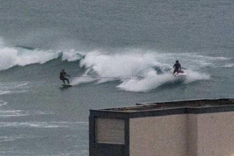 tow in surfers